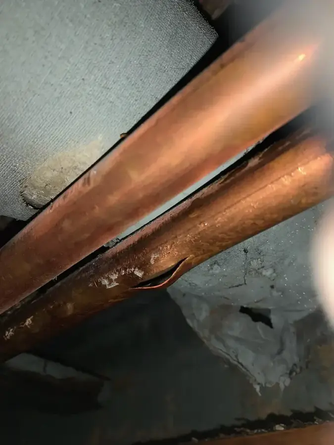 Water damage from a frozen and burst pipe in a Bedford, TX ceiling