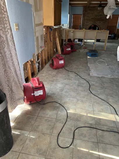 Air movers and dehumidifiers drying a Bedford, TX home